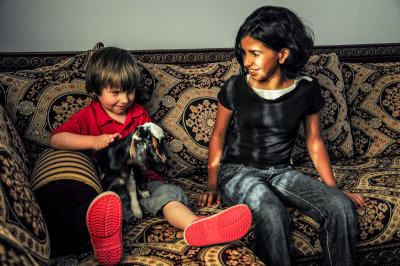 Mariam, Aleksander and the goat in the new house