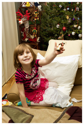 Opening presents on Christmas Eve. A sheep bell from Germany.