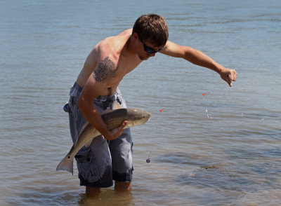 Fisherman with Redfish