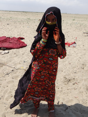 Bedouin girl, already wearing a veil