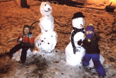 03 Violet and Sid making snowpeople after dark.jpg