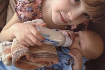 04 Violet feeding her new cousin Jackson.jpg