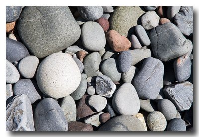 ...smooth stones in front of the lighthouse.