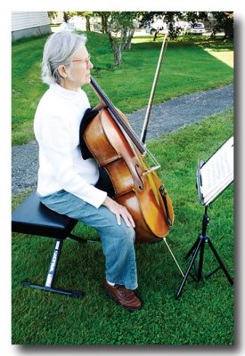 Then back in Lubec we find this lady practicing her cello on a church lawn.