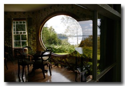 ...with this lovely oval window looking from diningroom to water....