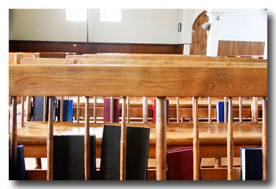 Inside the benches are lined with hymnals and books of Common Prayer.