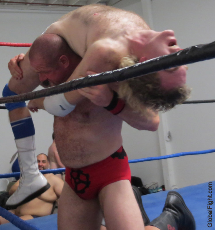 bearish guy carrying helpless punk.jpg
