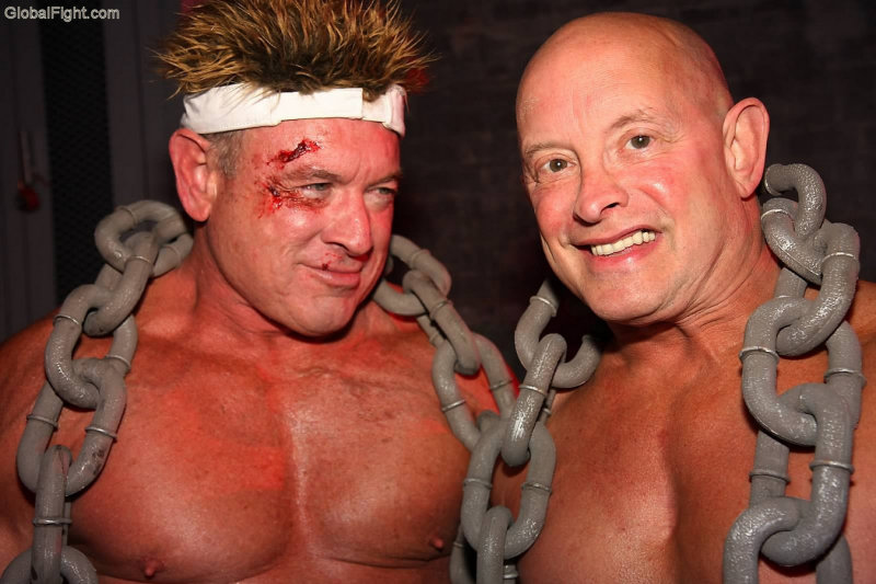 bloody face pro wrestlers wearing chains.jpg