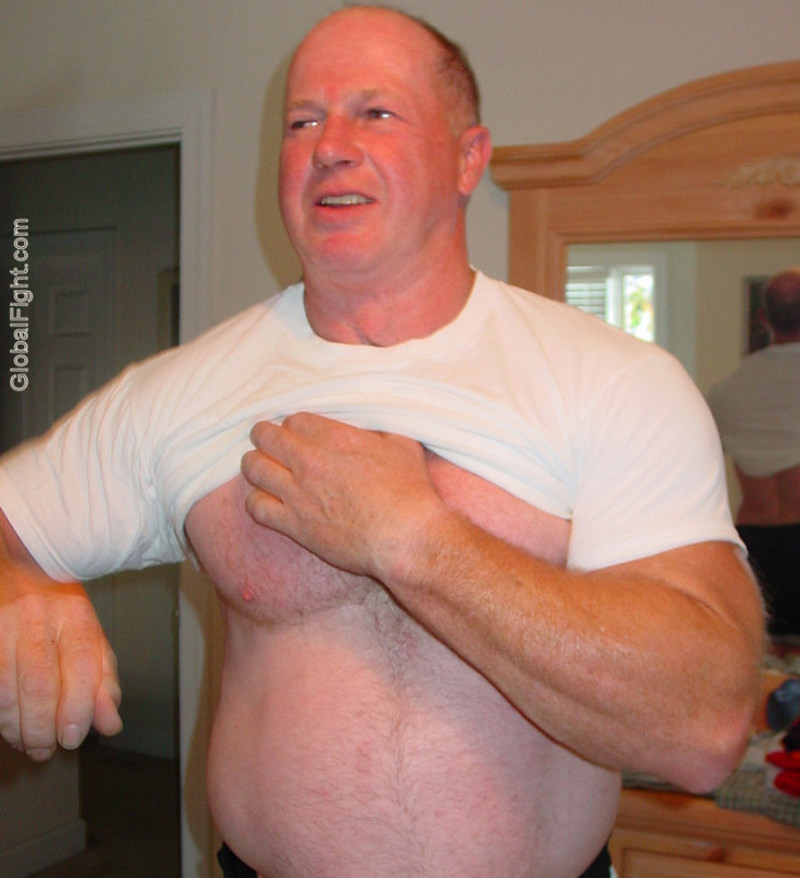 big powerlifter older man removing shirt.JPG