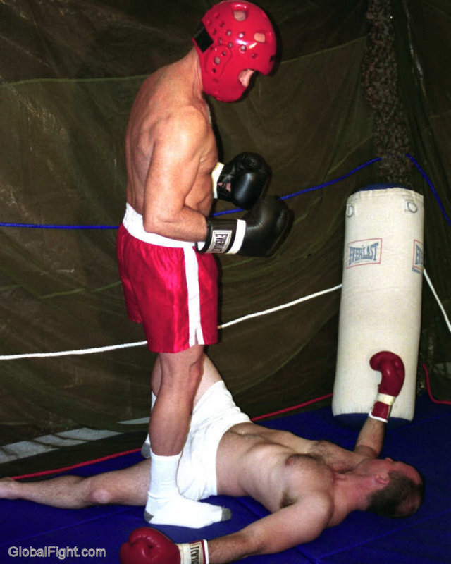 boxer standing over knocked out opponent.jpg