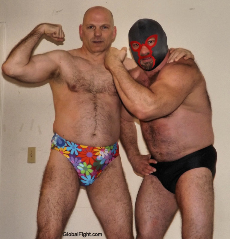 stocky hairy men flexing big arms.jpg