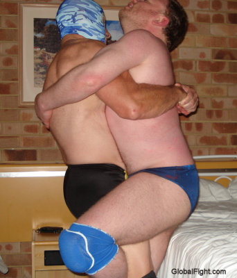 hunky daddy guys bearhugging stongman.jpg