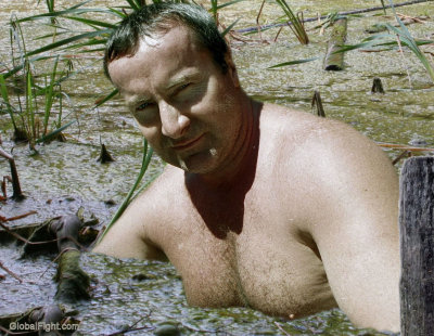 a man sitting swamp lake soaking wet guy.jpg
