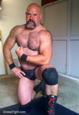 big beefy powerlifter flexing big hairy arms.jpg