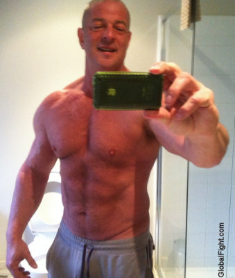 big muscled ripped chest tight abs older man.jpg