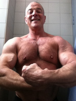 strong daddie flexing big arm muscles.jpg