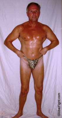 sweaty muscleman posing backstage silverdad.jpg