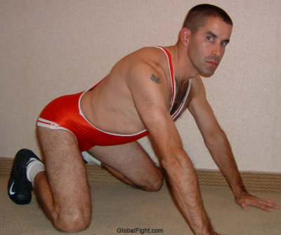 zgay hairy guy kneeling down on ground.jpg