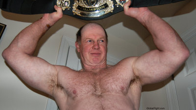 wrestling champion holding pro belt up.jpg