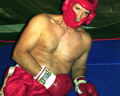 boxer sitting down resting ringside.jpg