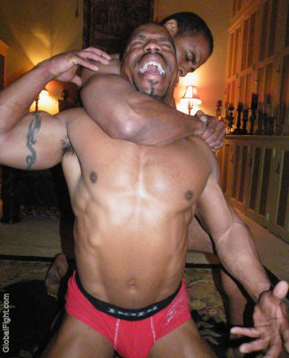 studly black musclemen getting choked rassling.jpg
