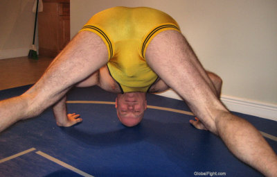 wrestler stretching out his big hairty legs thighs.jpg