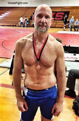 wrestler winning medal hunky older guy.jpg