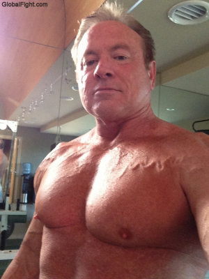 big irish muscleman posing shirtless gym.jpg