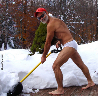 shirtless dad working hard shoveling snow.jpg