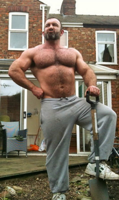tough macho hairy bodybuilder working yard.jpg