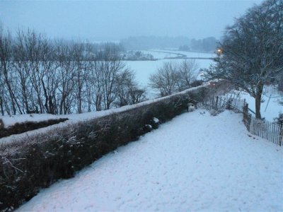 Still snowing at dusk