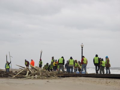 volunteers helping clear the debris and damage on the boardwalk