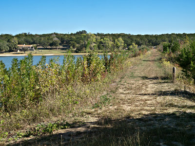 Rock and earthen dam with Refractory in background