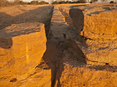 Long rock fence at entrance