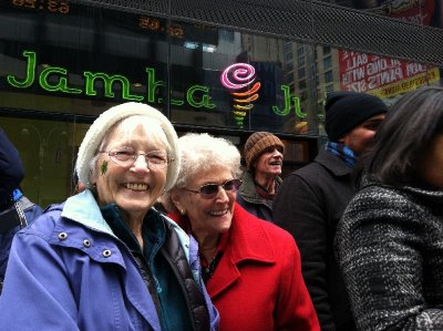 Joanie, Carol and my dad in brown hat, watching street entertainers