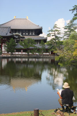 Bucolic lake in front of Nara's Todaiji Temple, with an artist sketching.