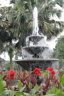 Plaza Armas fountain with flowers in the foreground.