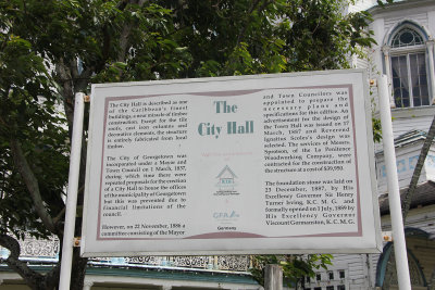 A sign describing the history of the City Hall.