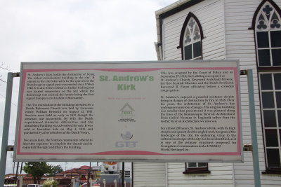 A sign describing the history of St. Andrew's Kirk Presbyterian Church.