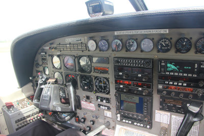 I sat in front next to the pilot, so I was in facing the controls of the plane.