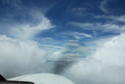 Interesting cloud formations as seen through the windshield of the plane.