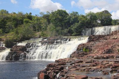 Orinduik Falls lie on the Ireng River, a highland river on the border with Brazil.