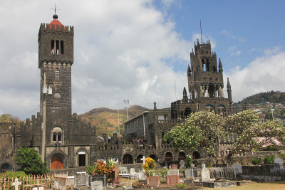 View of graveyard next to St. George's Cathedral with St. Mary's Roman Catholic  Cathedral of the Assumption in the background.