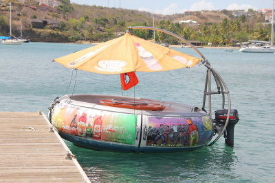 An unusual round party boat was at the end of the dock.