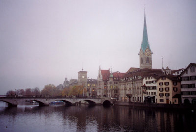 A Limatt River view with the  Fraumunster Church tower in the background.