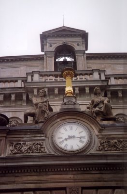 An impressive clock face with sculptures.