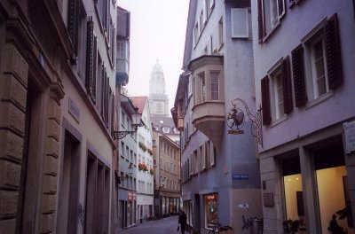 A quaint Zurich street with a nice sign on the right.