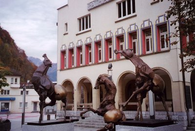 Tre Cavalli (2002) statues of horses by Swiss artist Nag Arnoldi in front of the Vaduz Town Hall.