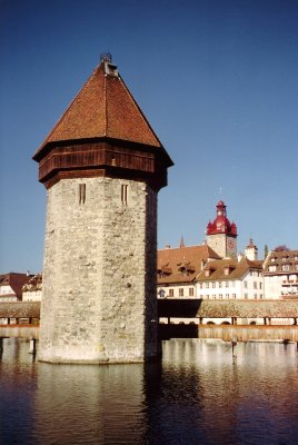 View of the Wasserturm (Water Tower), an octagonal tower, made from brick, which adjoins the Chapel Bridge.