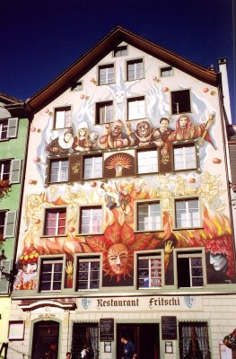 The architecture of the old city is adorned by large and colorful frescos such as this one.